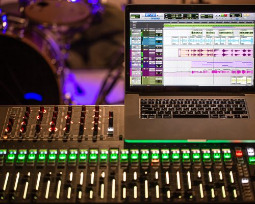 Digital mixer in a recording Studio , with a computer for recording sounds and music. The concept of creativity and show business. Digital mixer in a recording Studio , with a computer for recording sounds and music. The concept of creativity and show business. Space for text.